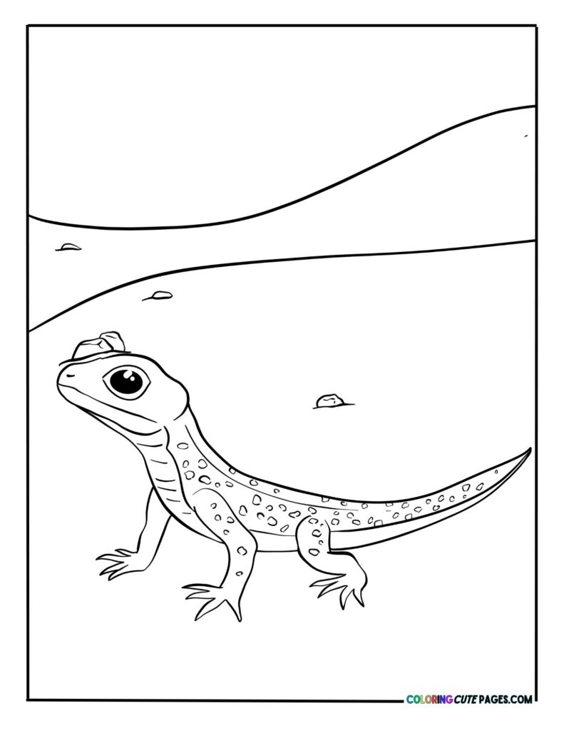 Baby gecko standing on sand